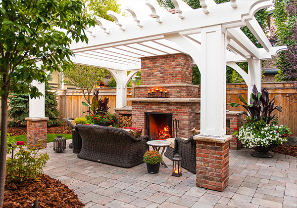 Patio with pergola and fireplace.